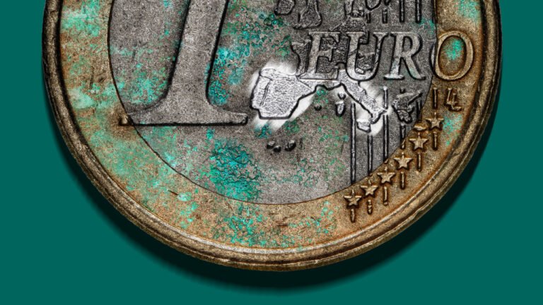 Illustration of a dirty Euro coin that has been rubbed clean on the shapes of Spain and Italy