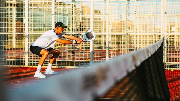 Man playing padel outdoors