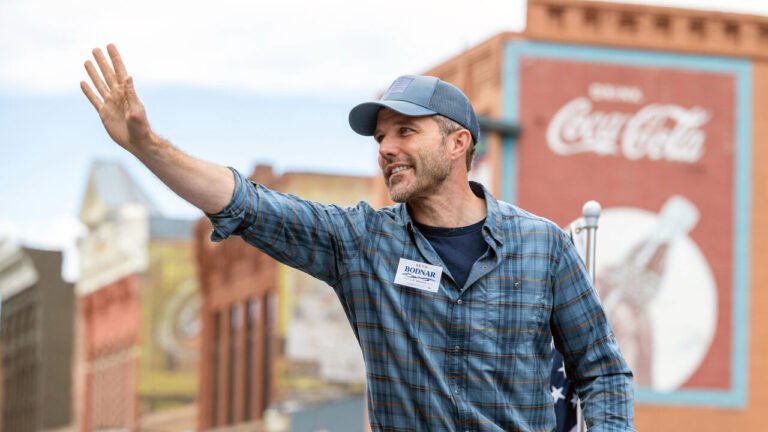 Seth Bodnar waves to the crowd at the annual Roundup Rodeo Parade.
