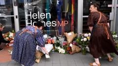 Man charged with attack on Australian MP as suspect's father says she is family friend